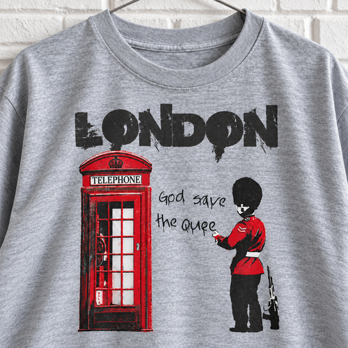 Grey London phone box and guard graphic tee on a white brick wall with a wire hanger — close-up front view